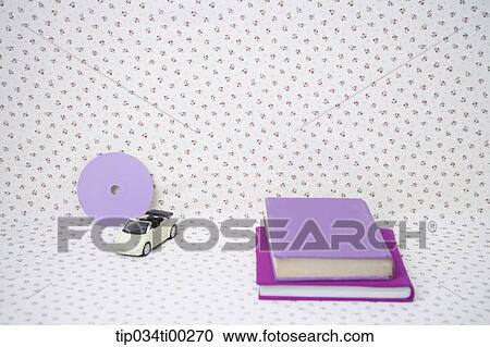 The purple cover books, mini car, and purple circular decoration View Large Photo Image Stock Image - The purple cover books, mini car, and purple circular decoration. Fotosearch
