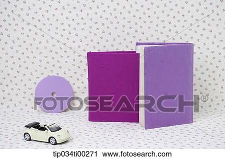 The purple cover books, mini car, and purple circular decoration View Large Photo Image Stock Image - The purple cover books, mini car, and purple circular decoration. Fotosearch