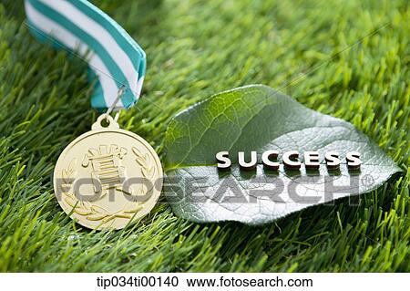 The 'SUCCESS' on the green leaf and golden medal View Large Photo Image Stock Image - The 'SUCCESS' on the green leaf and golden medal. Fotosearch