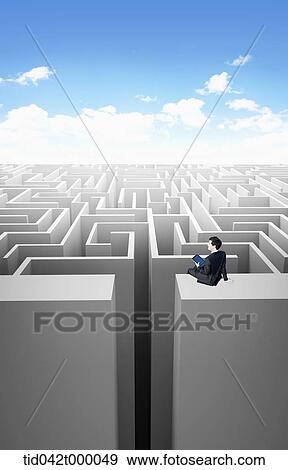 Stock Illustration - man looking down the maze. Fotosearch
