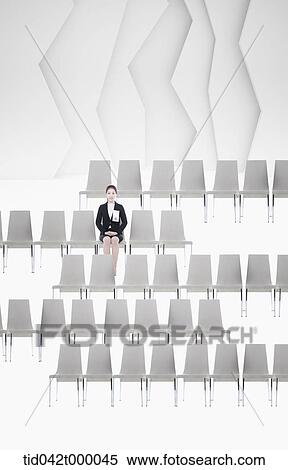 Stock Illustration - woman sitting on a chair . Fotosearch