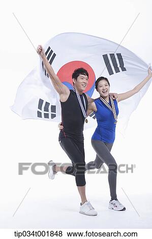 a couple holding Korean national flag on his hands and wearing a medals View Large Photo Image Stock Photo - a couple holding Korean national flag on his hands and wearing a medals. Fotosearch