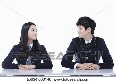 a couple of students facing each other View Large Photo Image Stock Photograph - a couple of students facing each other. Fotosearch