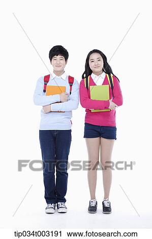 Stock Image - a couple of students holding folders. Fotosearch