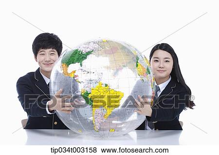 a couple of students holding globe together View Large Photo Image Stock Photo - a couple of students holding globe together. Fotosearch