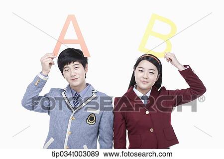 a couple of students holding letters of A and B View Large Photo Image Stock Photo - a couple of students holding letters of A and B. Fotosearch