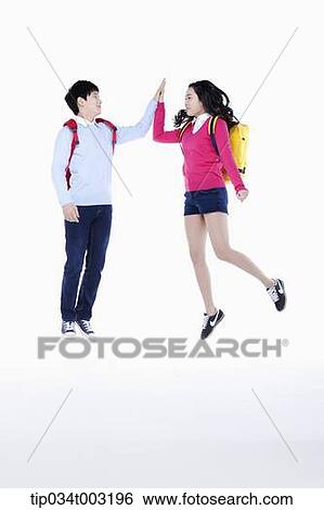 a couple of students slapping high-fives View Large Photo Image Stock Photograph - a couple of students slapping high-fives. Fotosearch