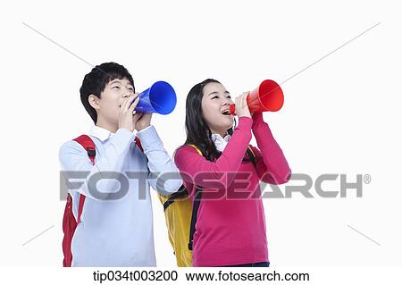 Stock Image - a couple of students speaking through megaphones. Fotosearch