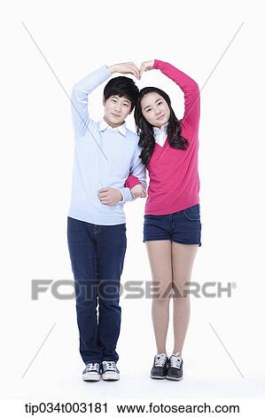 a couple of students standing arm in arm View Large Photo Image Stock Image - a couple of students standing arm in arm . Fotosearch