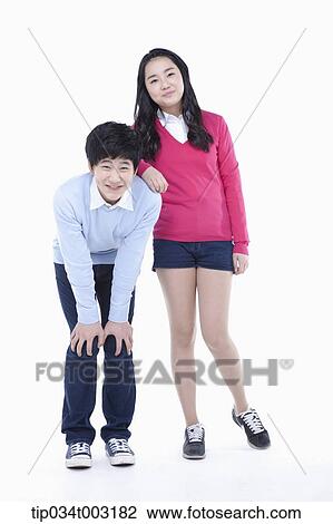 Stock Image - a couple of students standing together. Fotosearch