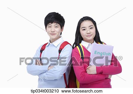Stock Image - a couple of students standing with their arms folded . Fotosearch