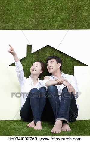 a couple sitting together in the paper house View Large Photo Image Stock Image - a couple sitting together in the paper house. Fotosearch