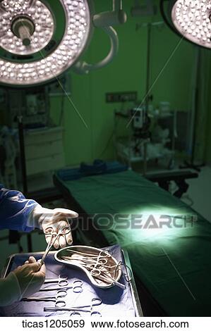 A doctor touching a medical equipments View Large Photo Image Stock Photo - A doctor touching a medical equipments . Fotosearch