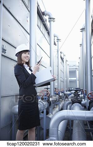A female architect with a radio receiver and a folder View Large Photo Image Stock Image - A female architect with a radio receiver and a folder. Fotosearch