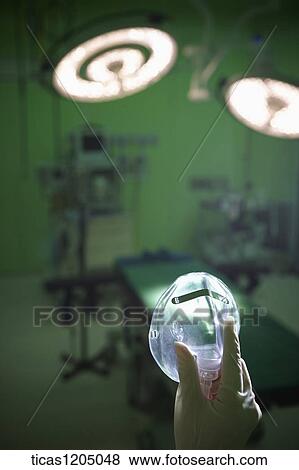 A hand holding a nasal mask in surgery room View Large Photo Image Stock Photo - A hand holding a nasal mask in surgery room. Fotosearch
