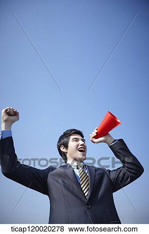 A picture of a businessman with a megaphone View Large Photo Image Stock Photo - A picture of a businessman with a megaphone. Fotosearch