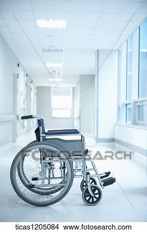 A picture of a side of a wheelchair in hospital corridor View Large Photo Image Picture - A picture of a side of a wheelchair in hospital corridor. Fotosearch