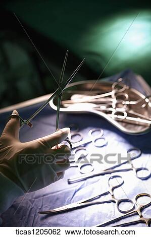 A surgeon picking scissors from different kinds of scissors View Large Photo Image Stock Image - A surgeon picking scissors from different kinds of scissors. Fotosearch
