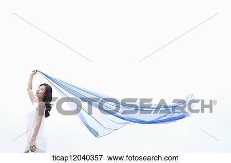 A woman holding a thin cloth with one hand View Large Photo Image Stock Photo - A woman holding a thin cloth with one hand . Fotosearch