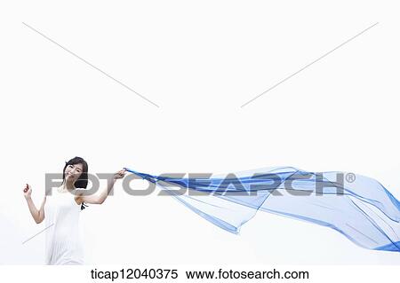 Stock Photography - A woman in white dress holding a thin linen . Fotosearch