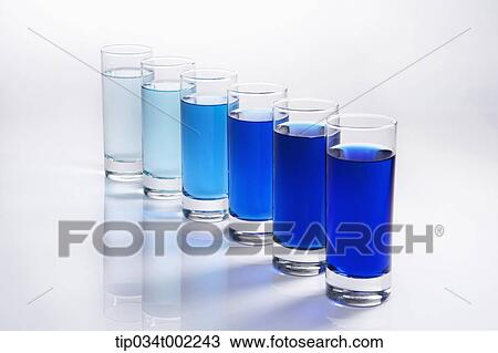 blue liquid in the glasses in a row View Large Photo Image Stock Image - blue liquid in the glasses in a row. Fotosearch