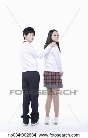 Picture - boy putting his arm around girl's shoulde. Fotosearch