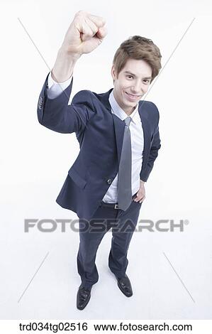 Stock Photograph - businessman clenching his fists . Fotosearch