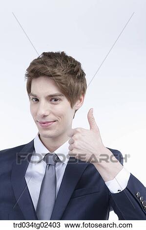 businessman giving a thumbs-up View Large Photo Image Stock Image - businessman giving a thumbs-up. Fotosearch