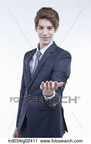businessman holding out his hand View Large Photo Image Stock Image - businessman holding out his hand. Fotosearch