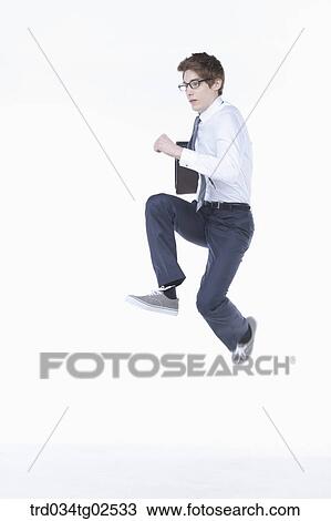 businessman jumping into the air View Large Photo Image Stock Image - businessman jumping into the air. Fotosearch