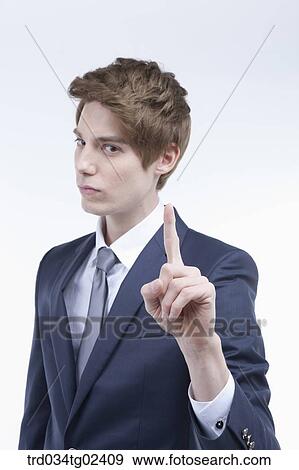 Stock Photo - businessman showing his index finger. Fotosearch