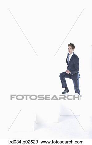 businessman stepping up the box View Large Photo Image Stock Photo - businessman stepping up the box. Fotosearch