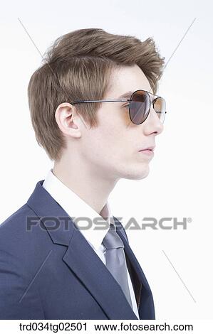 Stock Image - businessman wearing a par of sunglasses. Fotosearch