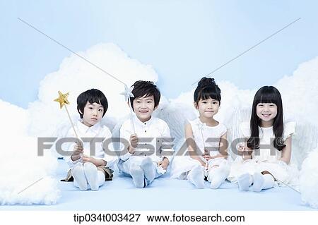 four kids with looks of angels on the clouds View Large Photo Image Stock Photo - four kids with looks of angels on the clouds. Fotosearch