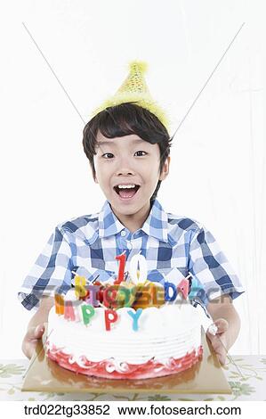 kid holding a birthday cake on his arms View Large Photo Image Stock Image - kid holding a birthday cake on his arms. Fotosearch
