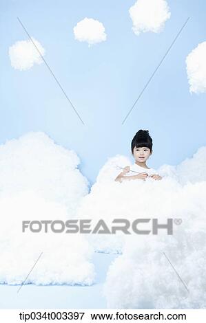 little girl looks of angel on the clouds View Large Photo Image Stock Photo - little girl looks of angel on the clouds. Fotosearch
