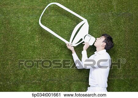 Stock Image - man drinking water in the bottle. Fotosearch