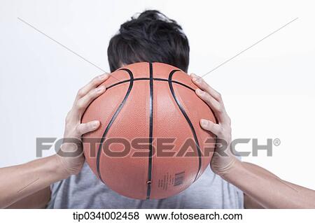 man holding a basketball View Large Photo Image Stock Photo - man holding a basketball. Fotosearch