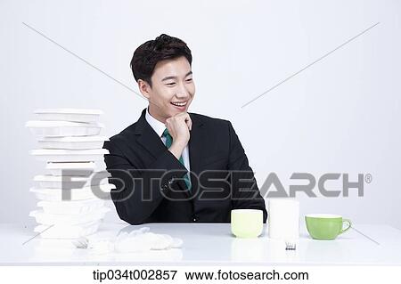 man looking at green cups with smile View Large Photo Image Stock Photo - man looking at green cups with smile. Fotosearch