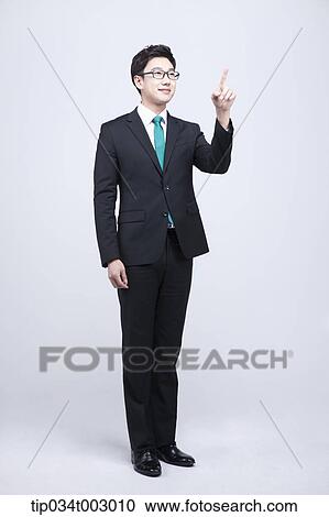 Stock Image - man pointing out with his index finger . Fotosearch