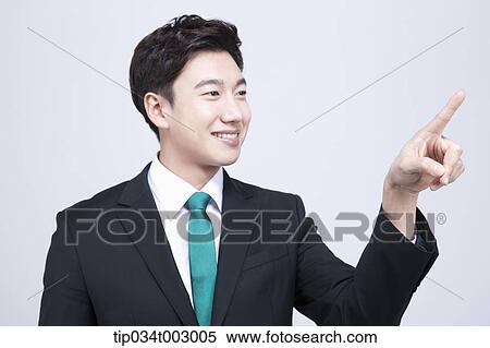 Stock Photography - man pointing out with his index finger . Fotosearch