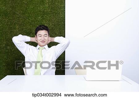 man putting his hand on the back of his neck View Large Photo Image Picture - man putting his hand on the back of his neck. Fotosearch