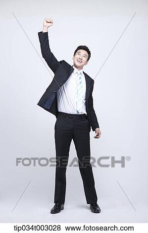 man raising up his fist View Large Photo Image Stock Photo - man raising up his fist . Fotosearch