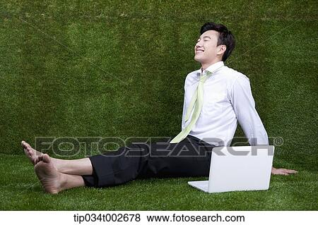 man sitting in the current of breeze View Large Photo Image Stock Photo - man sitting in the current of breeze . Fotosearch