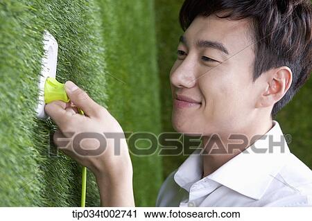 man taking off the plug on the wall View Large Photo Image Stock Image - man taking off the plug on the wall. Fotosearch