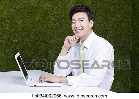 man using computer on the table View Large Photo Image Stock Photograph - man using computer on the table. Fotosearch