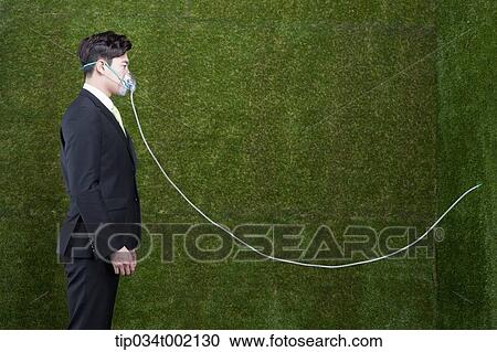 Stock Image - man wearing respirator. Fotosearch