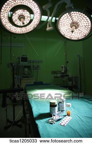 Stock Image - Medicines on surgery bed. Fotosearch