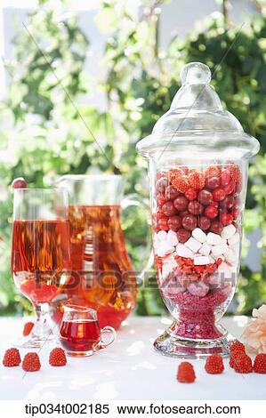 Stock Photography - raspberry juice and raspberry jelly candies . Fotosearch
