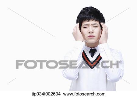 schoolboy having a headache View Large Photo Image Picture - schoolboy having a headache. Fotosearch
